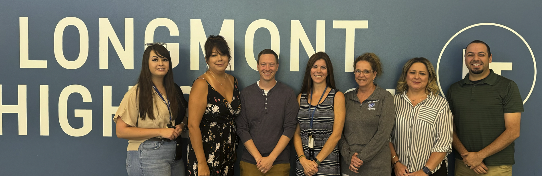 Photo of the counseling team against a Longmont High background